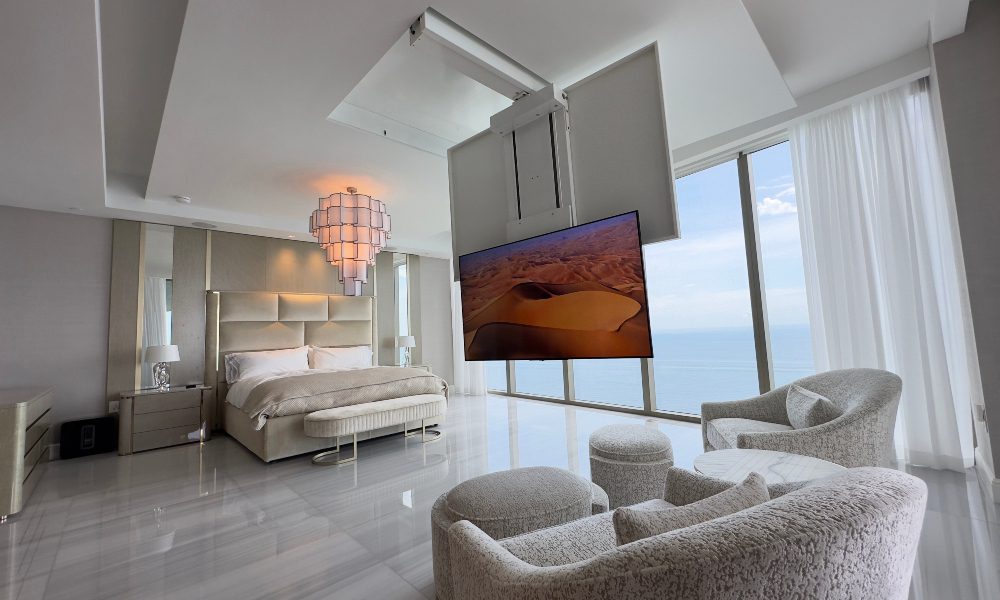 Premium Audio Digital dropdown motorized TV mount interior clean minimalist modern design oceanside Miami Florida.