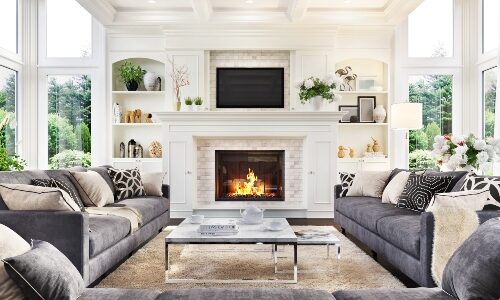 TV mounted over fireplace in modern home.